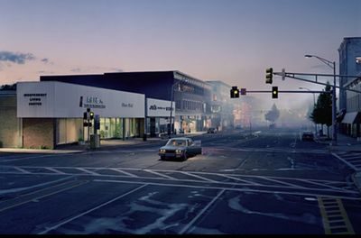 a car is driving down a city street