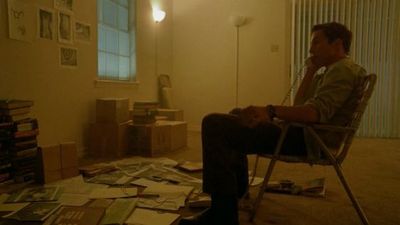 a man sitting in a chair in a room