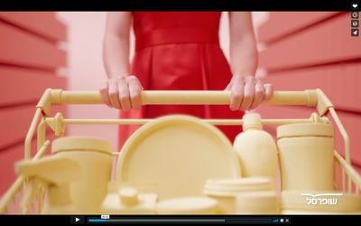 a woman in a red dress holding a yellow dish rack