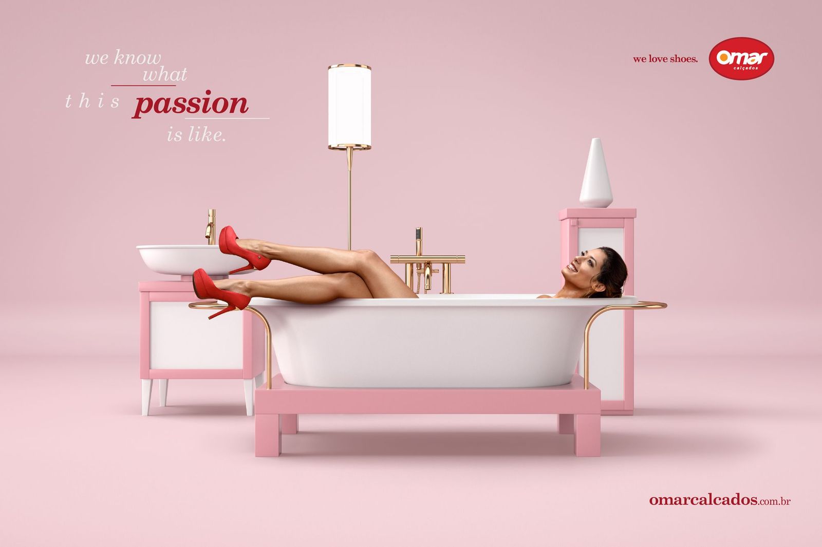 a woman laying in a bathtub with red high heels