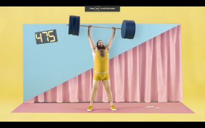 a man in a yellow bodysuit lifting a barbell