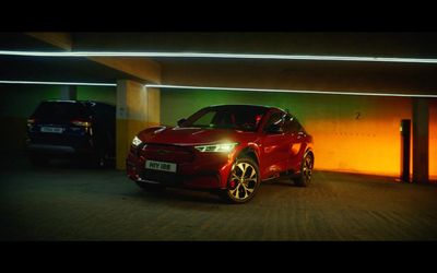 a red car parked in a parking garage