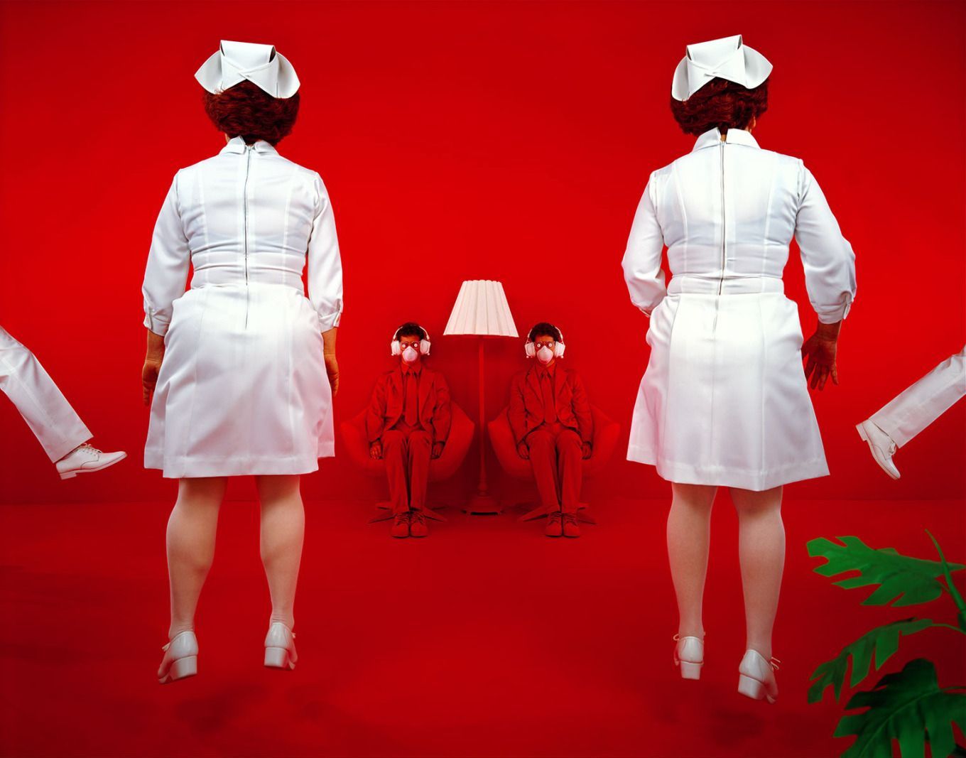 a couple of women in white uniforms standing next to each other