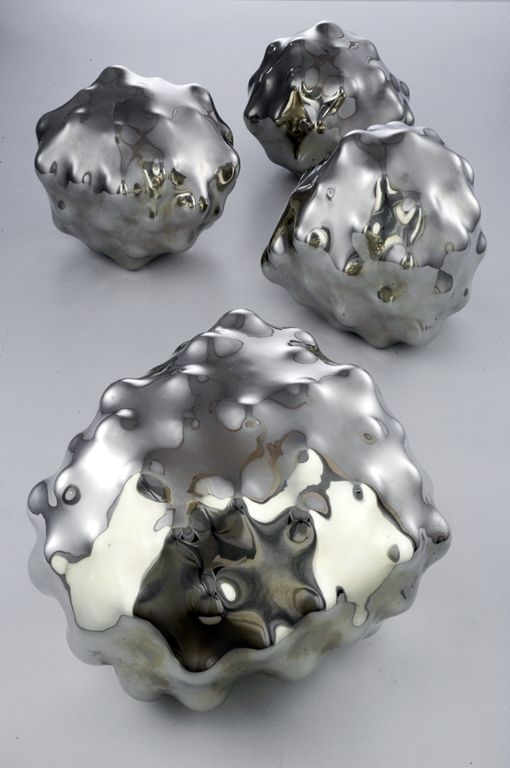 a group of silver objects sitting on top of a table