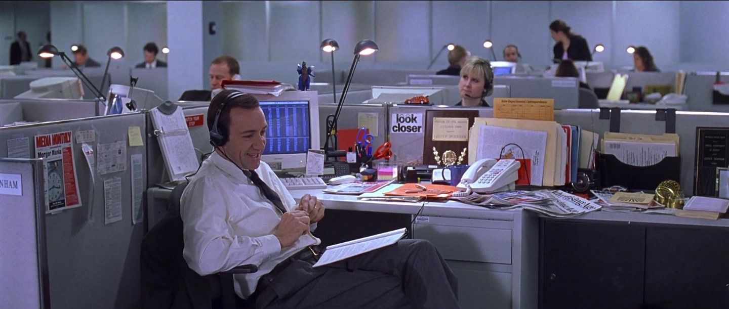 a man sitting at a desk in an office