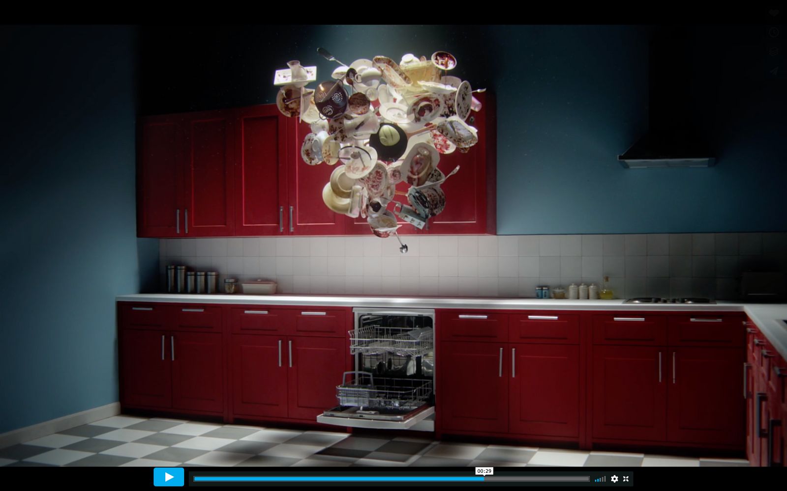 a kitchen with red cabinets and a chandelier