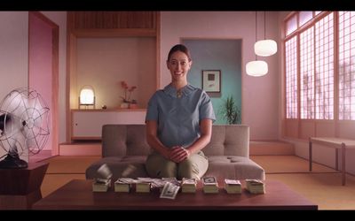 a woman sitting on a couch in a living room