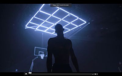 a man standing in front of a basketball hoop