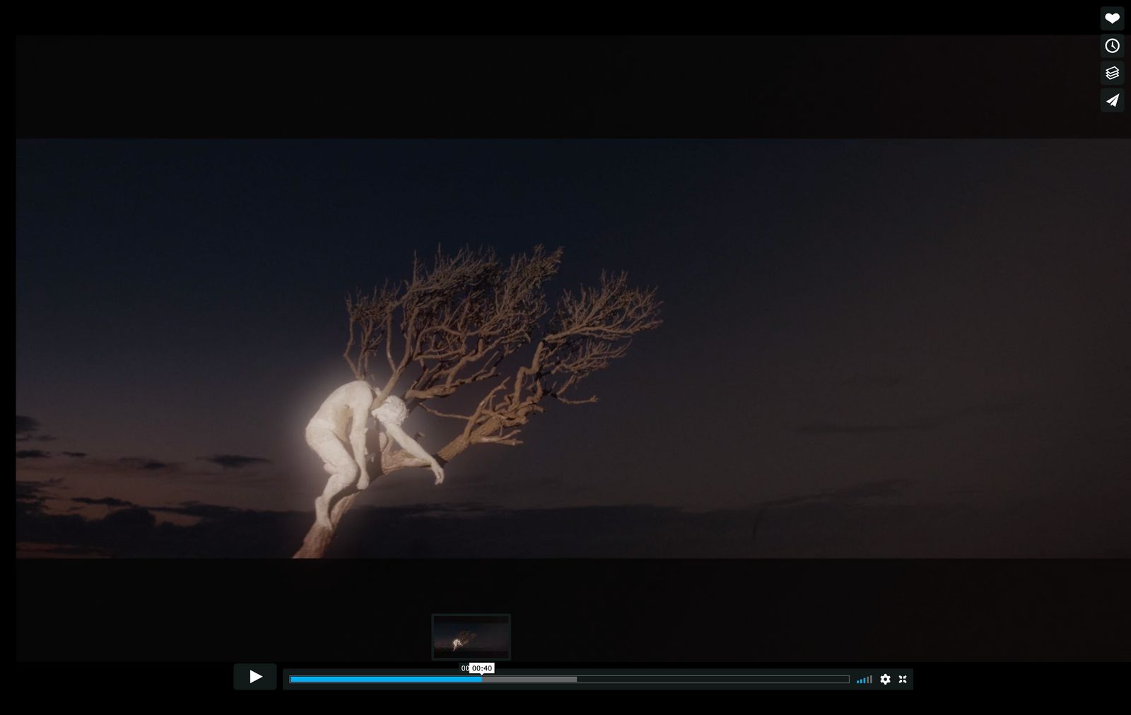 a person standing in front of a tree at night