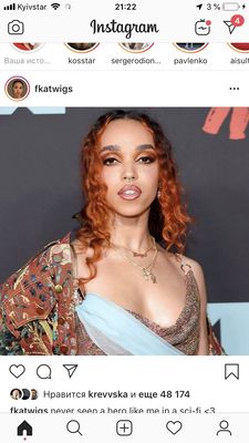 a woman with red hair wearing a dress