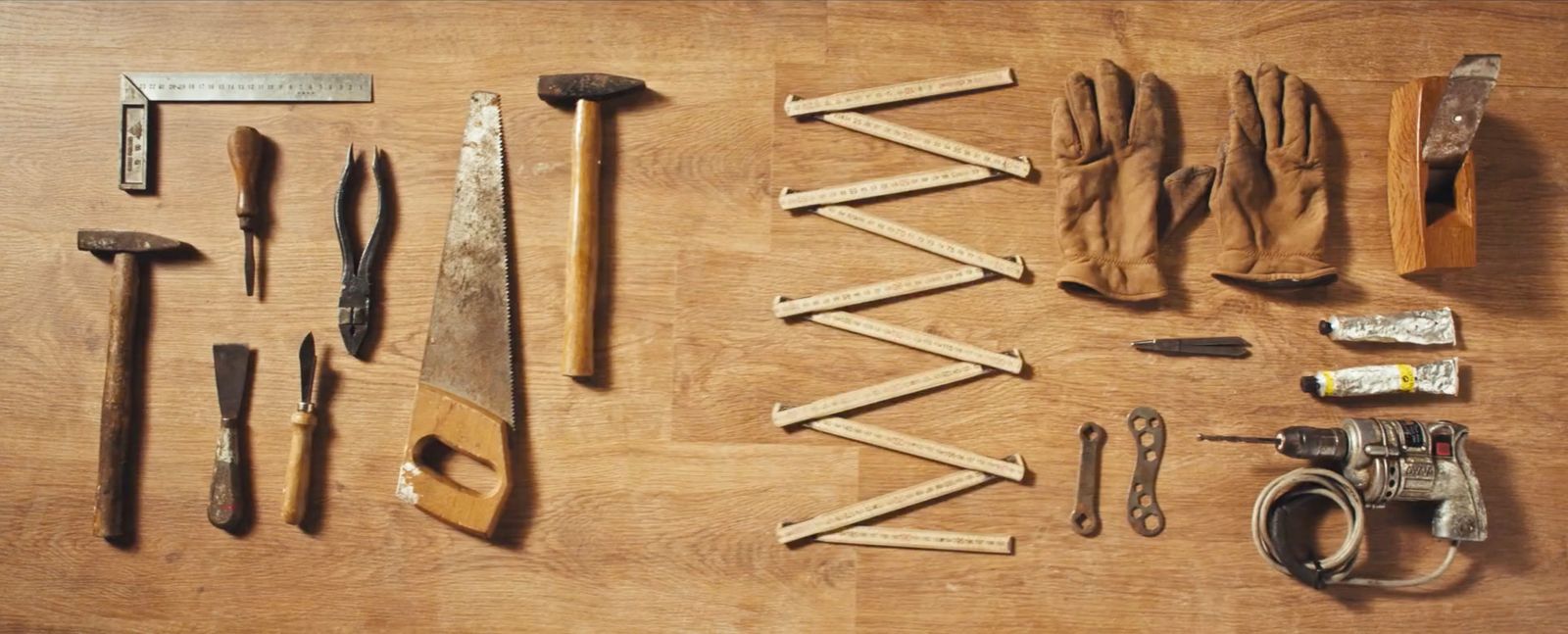 a wooden table topped with lots of tools