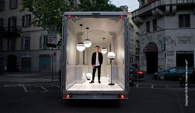 a man standing in the back of a truck