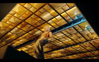 a man standing in front of a ceiling covered in lights