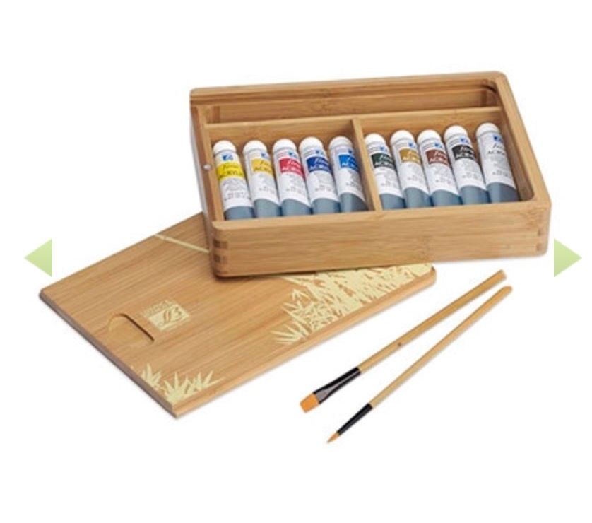 a wooden box filled with paint and brushes