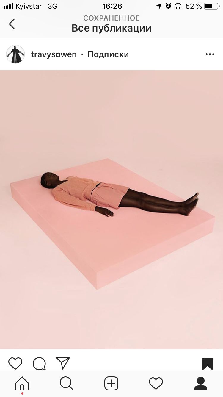 a woman laying on top of a pink surface