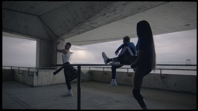 a group of people standing on top of a roof