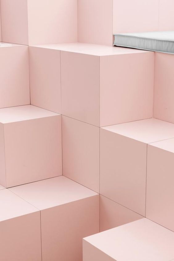 a room filled with lots of pink cubes