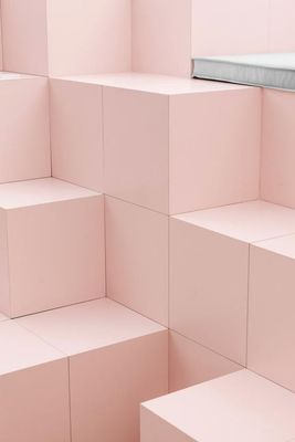 a room filled with lots of pink cubes