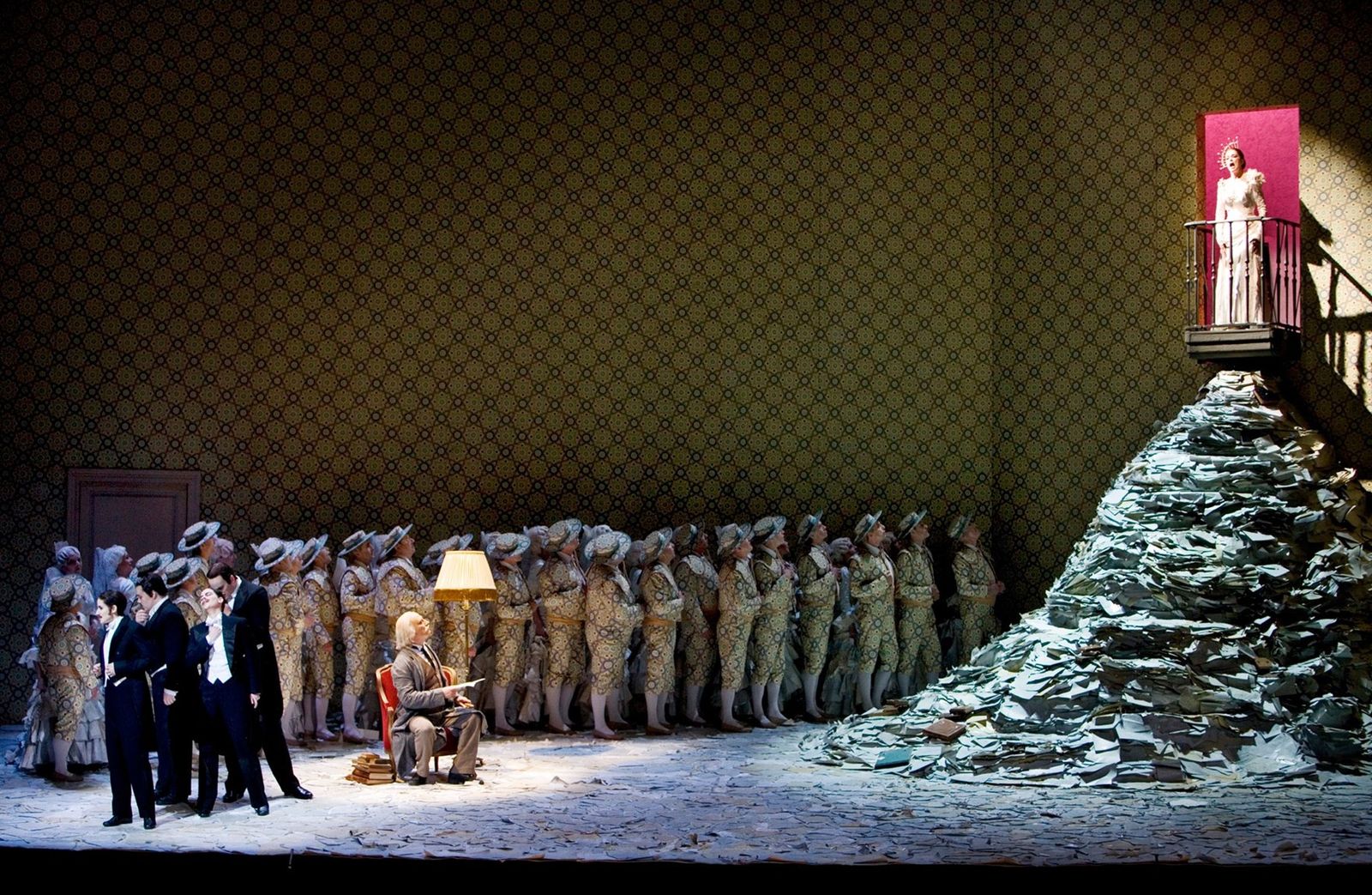 a group of people standing around a pile of trash