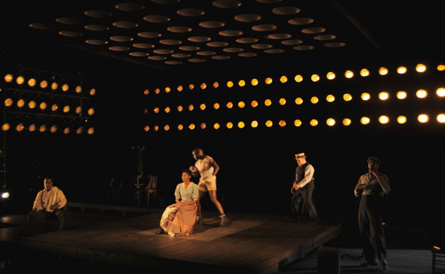 a group of people standing on top of a stage