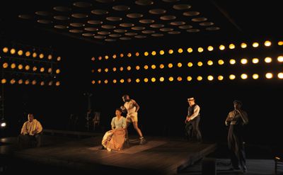 a group of people standing on top of a stage