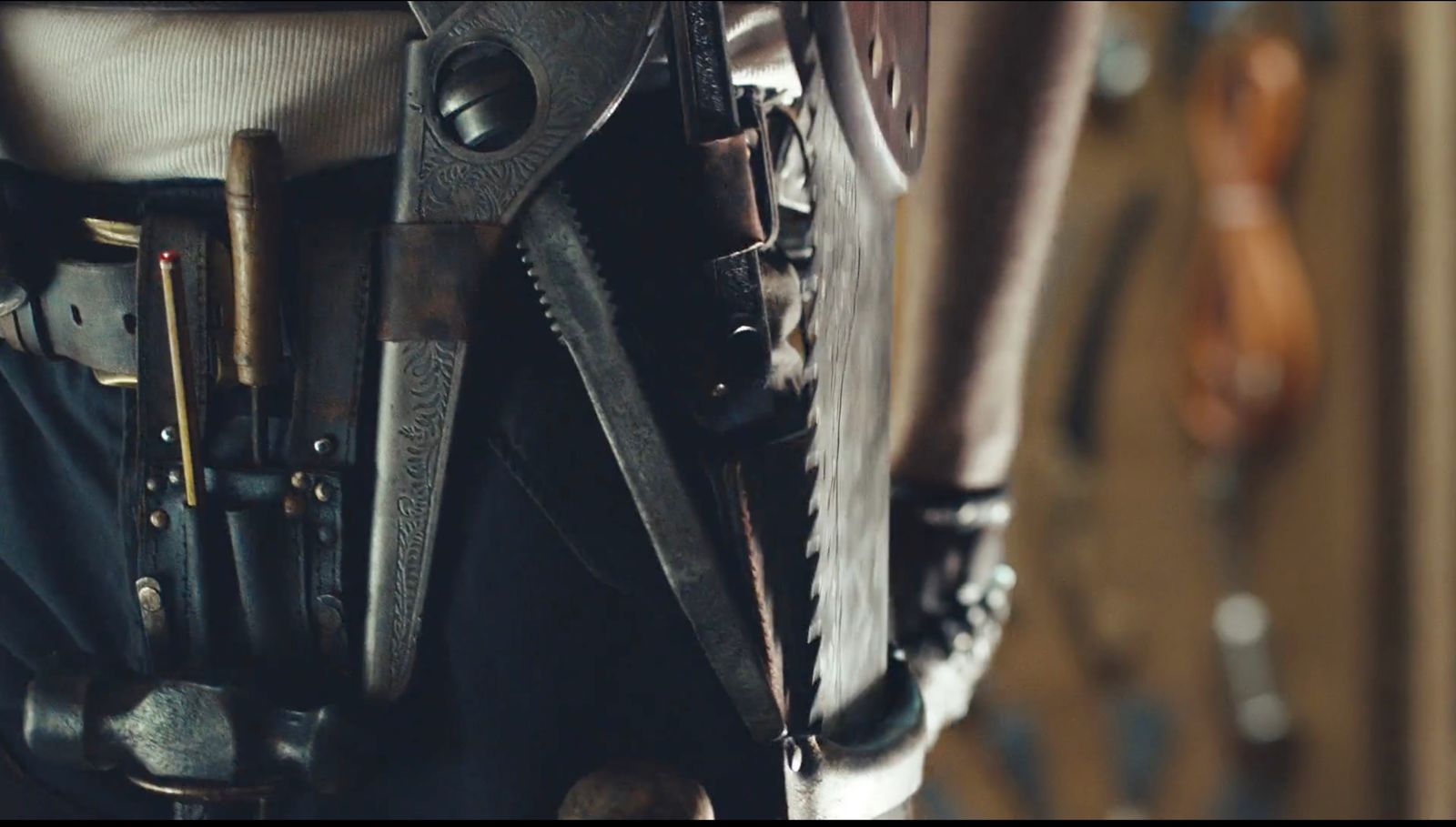 a close up of a person holding a pair of scissors