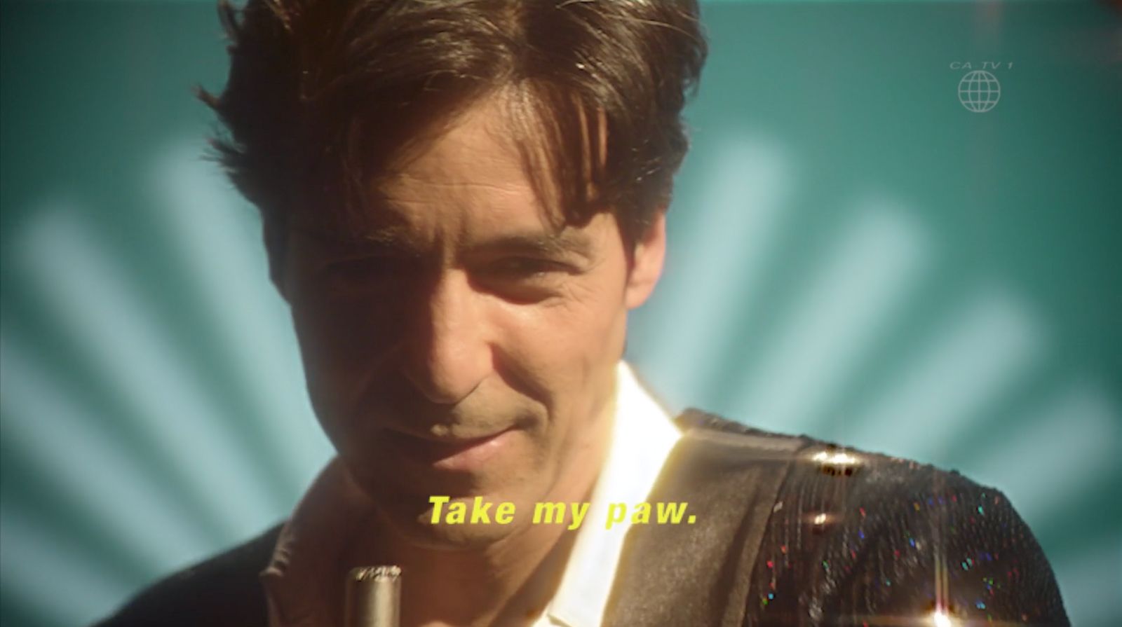 a man holding a microphone in his right hand