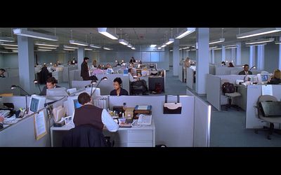 an office filled with people working at desks