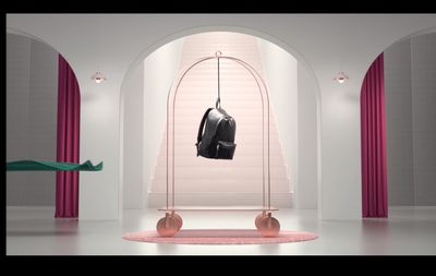 a black bag hanging from a metal rack