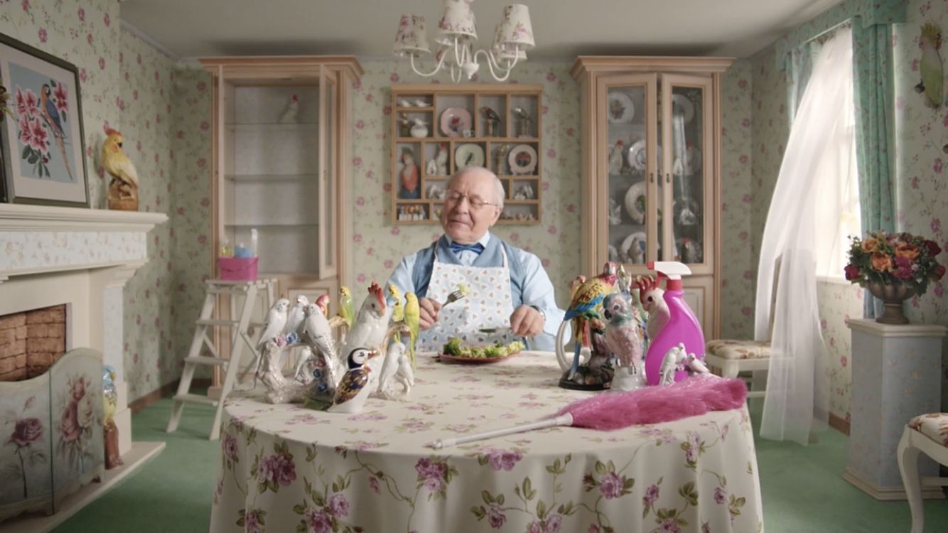 a man sitting at a table with a plate of food in front of him