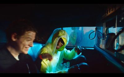 a person in a car with a hoodie on