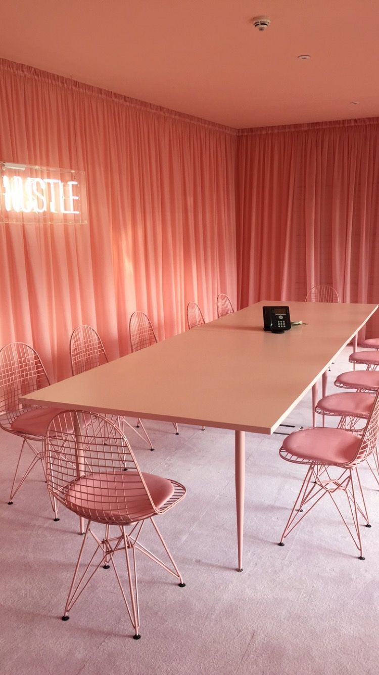 a conference room with a long table and chairs