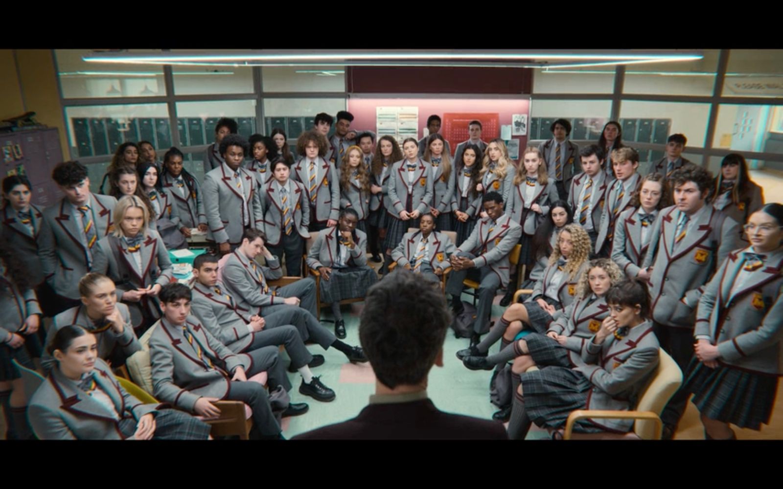 a group of people in school uniforms posing for a picture