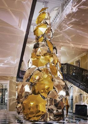 a christmas tree made out of gold foil