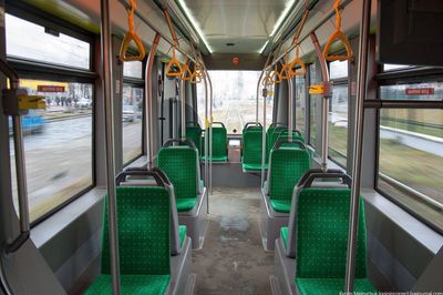 a bus filled with lots of green seats