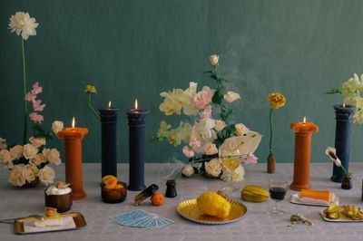 a table topped with lots of different types of candles