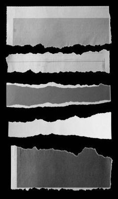 a black and white photo of torn paper