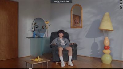 a person sitting in a chair in a room