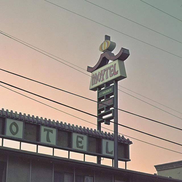 a motel sign on top of a building