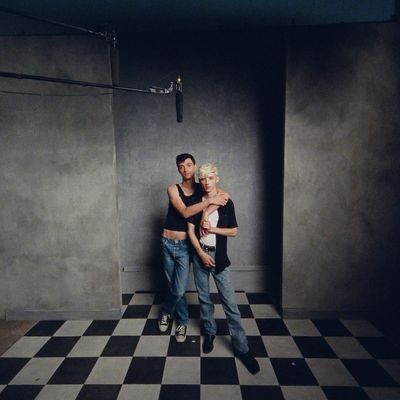 a couple of people that are standing in a room