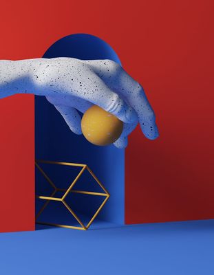 a person's hand reaching for an orange in a blue box