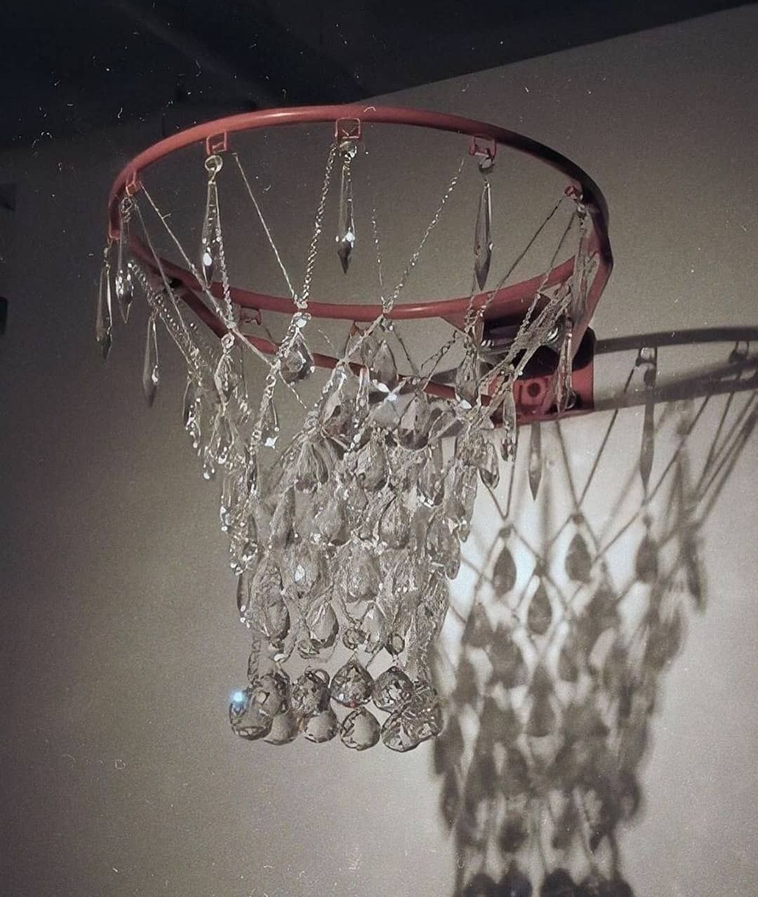 a basketball hoop with crystal beads hanging from it