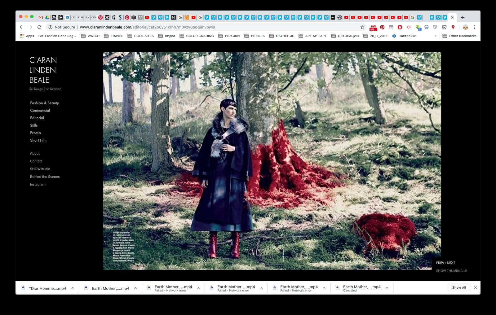 a woman standing in a forest next to a red object