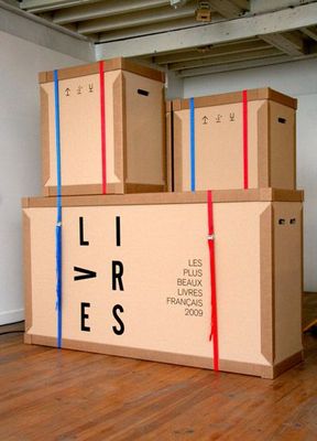a large cardboard box sitting on top of a hard wood floor
