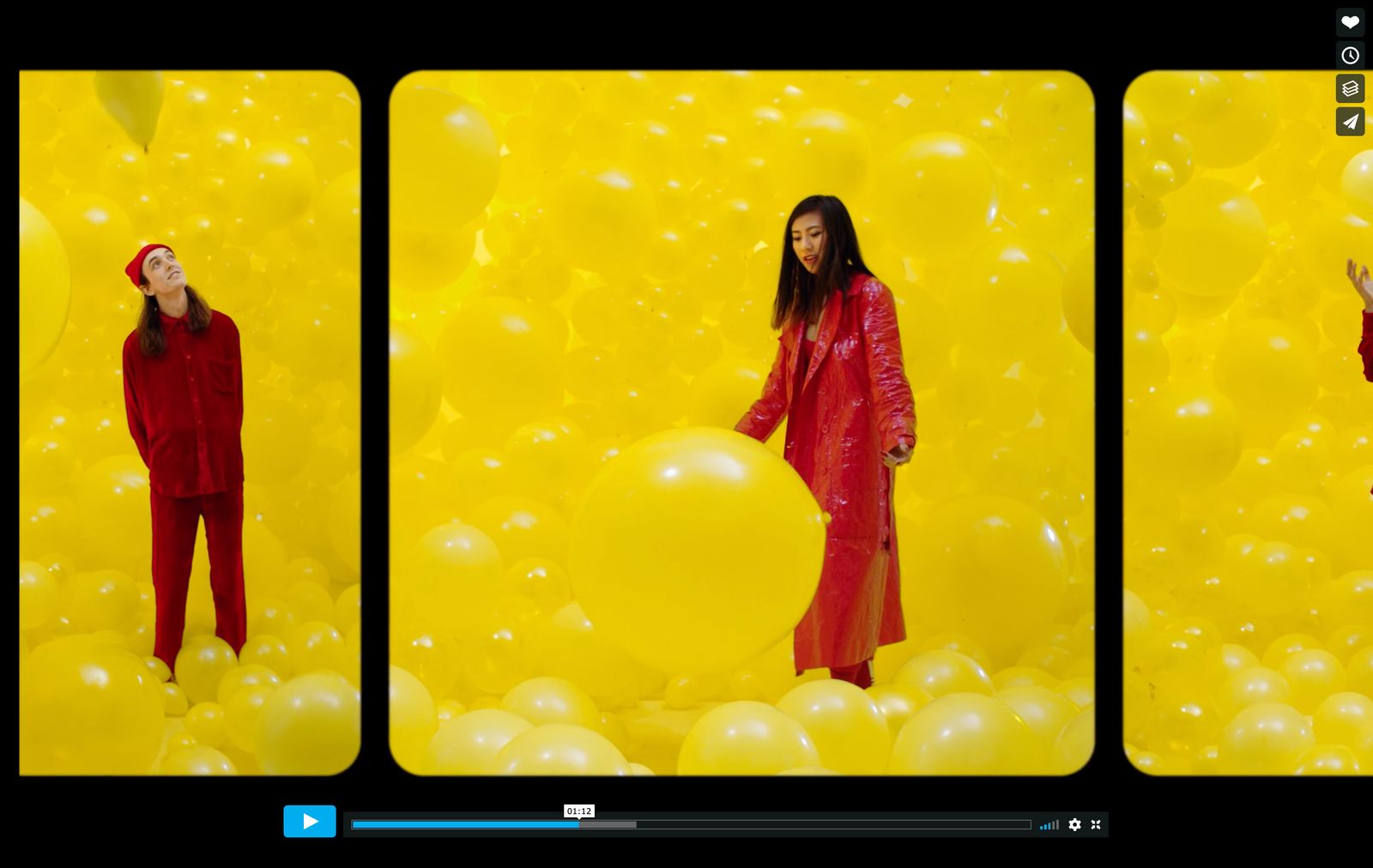 a woman in a red outfit standing in front of balloons