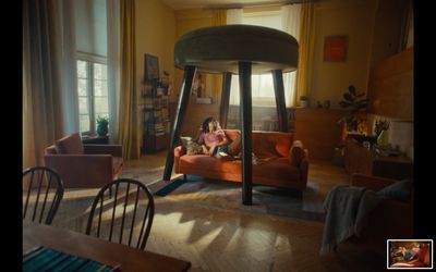 a woman sitting on a couch in a living room