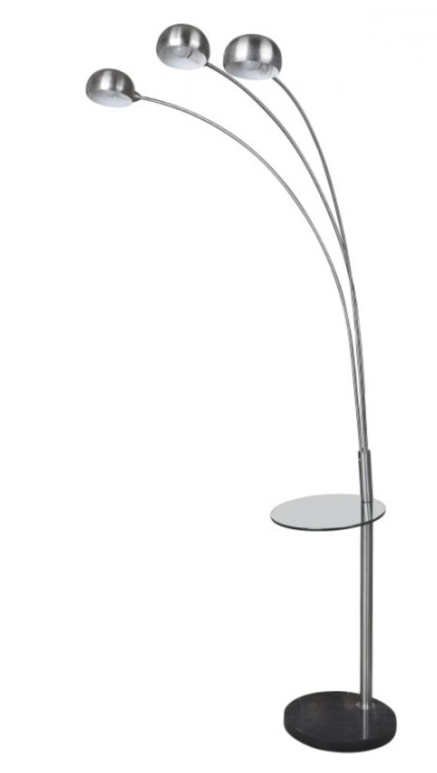 a metal and glass floor lamp on a white background