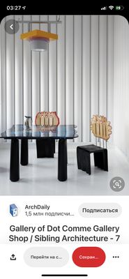 a table with chairs and a lamp on top of it