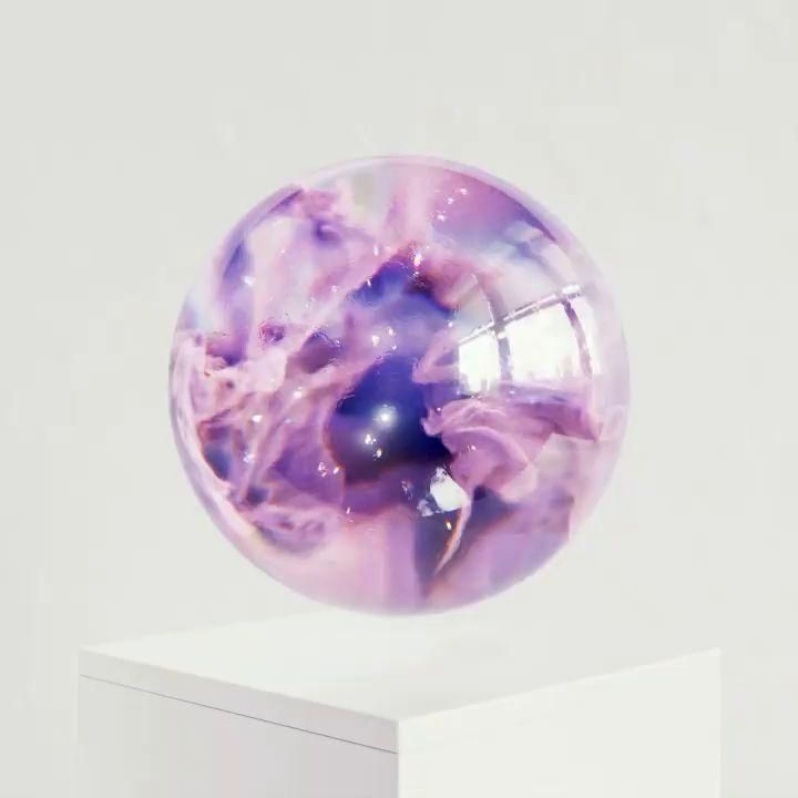 a purple and white object sitting on top of a white pedestal