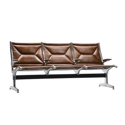 a brown leather bench sitting on top of a metal frame